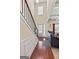 Bright foyer with hardwood floors, staircase, and view into the living room at 4770 Macy Way, Ellenwood, GA 30294