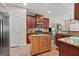 Well-equipped kitchen featuring cherry cabinets, stainless steel appliances, and granite countertops at 4770 Macy Way, Ellenwood, GA 30294