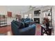Open-concept living area with fireplace, TV, access to the dining area and plenty of seating, perfect for entertaining at 4770 Macy Way, Ellenwood, GA 30294