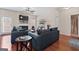 Comfortable living room with hardwood floors, fireplace, ceiling fan, and contemporary furnishings, ready for relaxation at 4770 Macy Way, Ellenwood, GA 30294