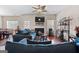 Spacious living room showcasing a cozy fireplace, ceiling fan, stylish sofas, and an open floor plan for entertaining at 4770 Macy Way, Ellenwood, GA 30294