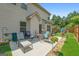 Outdoor patio features a seating area, potted plants, and a well-maintained lawn for relaxation and entertainment at 4770 Macy Way, Ellenwood, GA 30294