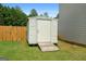 Backyard storage shed offers convenient space for tools and equipment, keeping the lawn tidy and organized at 4770 Macy Way, Ellenwood, GA 30294