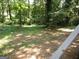 View of a spacious backyard with mature trees at 4350 Lincolndale Dr, Ellenwood, GA 30294