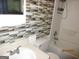 Bathroom featuring a white shower-tub combo with a toilet and a sink at 4350 Lincolndale Dr, Ellenwood, GA 30294