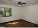 Bright bedroom with a window bringing in natural light and featuring a ceiling fan at 4350 Lincolndale Dr, Ellenwood, GA 30294