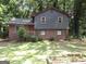 Charming home with a brick facade and well-maintained lawn at 4350 Lincolndale Dr, Ellenwood, GA 30294