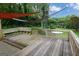 Comfortable back porch with built-in seating and shade sails creating a relaxing outdoor space at 4852 Pine Shadows, Stone Mountain, GA 30088