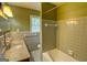 Bathroom featuring granite countertops, vanity sink, tiled shower and bath at 4852 Pine Shadows, Stone Mountain, GA 30088