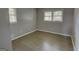 Cozy bedroom with wood floors and windows for natural light at 4852 Pine Shadows, Stone Mountain, GA 30088