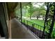 Inviting front porch featuring decorative iron railings and landscaped garden beds at 4852 Pine Shadows, Stone Mountain, GA 30088
