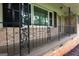 Close-up of charming front porch featuring decorative railings and classic brickwork at 4852 Pine Shadows, Stone Mountain, GA 30088