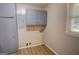 Laundry room with built in storage cabinets and window for natural lighting at 4852 Pine Shadows, Stone Mountain, GA 30088