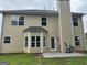 Rear elevation of the home, revealing a patio, windows, and a chimney at 4199 Elderberry Nw Dr, Acworth, GA 30101
