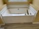 A close-up view of a large, white bathtub, perfect for soaking, is featured at 4199 Elderberry Nw Dr, Acworth, GA 30101