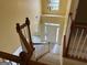View from the top of the stairs down into the foyer with a view of the front door at 4199 Elderberry Nw Dr, Acworth, GA 30101