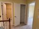 Upstairs hallway with linen closet and view to bathroom and a bedroom at 4199 Elderberry Nw Dr, Acworth, GA 30101