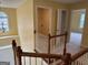 Hallway on the second floor with views to closet, laundry closet, and bedroom at 4199 Elderberry Nw Dr, Acworth, GA 30101