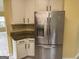 Kitchen with stainless steel refrigerator and white cabinets at 4199 Elderberry Nw Dr, Acworth, GA 30101