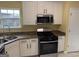 Modern kitchen featuring stainless steel appliances and white cabinets at 4199 Elderberry Nw Dr, Acworth, GA 30101
