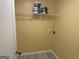 Utility room with vinyl floors, an outlet for the dryer, and storage space for your laundry products at 4199 Elderberry Nw Dr, Acworth, GA 30101