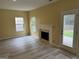 Bright living room with a fireplace and vinyl flooring at 4199 Elderberry Nw Dr, Acworth, GA 30101