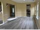 Open-concept living area with views to the kitchen and vinyl flooring at 4199 Elderberry Nw Dr, Acworth, GA 30101