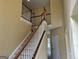 Staircase with wooden handrail and white risers at 4199 Elderberry Nw Dr, Acworth, GA 30101