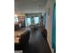 Open-concept living space with hardwood floors seamlessly connecting the living, dining, and kitchen areas at 1945 Labonte Pkwy # 42, Mcdonough, GA 30253