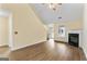 Open living room features hard wood floors, a cozy fireplace, and lots of natural light at 167 London Dr, Mcdonough, GA 30253