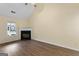 Bright living room featuring a fireplace, vaulted ceilings, and hard wood floors at 167 London Dr, Mcdonough, GA 30253