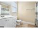 A clean bathroom boasts a single sink vanity, a toilet, and neutral finishes at 110 Camford Stone Path, Fayetteville, GA 30214