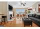 Spacious living room featuring a fireplace, hardwood floors, and ample natural light at 110 Camford Stone Path, Fayetteville, GA 30214