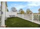 A well-kept patio with synthetic turf and a cozy seating area under a bright sky at 110 Camford Stone Path, Fayetteville, GA 30214