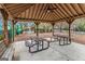 Community picnic area with picnic tables and a ceiling fan is great for outdoor events at 110 Camford Stone Path, Fayetteville, GA 30214