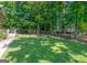 Beautifully maintained lawn and landscaping with mature trees provides a peaceful setting at 200 Savannah Walk, Peachtree City, GA 30269