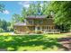 Expansive backyard featuring a spacious deck and mature trees offering shade and privacy at 200 Savannah Walk, Peachtree City, GA 30269