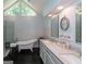 Bright bathroom with double vanity, freestanding tub, and a glass shower at 200 Savannah Walk, Peachtree City, GA 30269