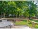 A spacious deck featuring a table and chairs is perfect for outdoor gatherings and relaxation at 200 Savannah Walk, Peachtree City, GA 30269