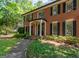 Inviting brick home with a covered entrance and well-maintained landscaping at 200 Savannah Walk, Peachtree City, GA 30269