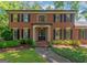 Traditional brick facade with black shutters and an inviting front entrance at 200 Savannah Walk, Peachtree City, GA 30269