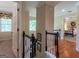 Second floor hallway, featuring hardwood floors, with view to bedroom and entry to stairs at 200 Savannah Walk, Peachtree City, GA 30269