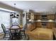 Bright kitchen with a breakfast nook, wooden cabinets, stainless steel appliances, and hardwood floors at 200 Savannah Walk, Peachtree City, GA 30269