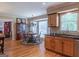 Kitchen with stainless steel appliances, wood cabinets, adjacent to breakfast nook at 200 Savannah Walk, Peachtree City, GA 30269