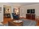 Inviting living room with hardwood floors, and a comfortable sitting area at 200 Savannah Walk, Peachtree City, GA 30269
