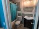 Bathroom featuring vanity with sink, toilet, and bathtub with shower curtain at 2071 Scarbrough, Stone Mountain, GA 30088