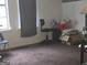 A tidy bedroom with a chair, window, and a cheerful atmosphere at 2071 Scarbrough, Stone Mountain, GA 30088