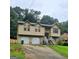 Charming two-story home with a well-maintained lawn and a two car garage at 2071 Scarbrough, Stone Mountain, GA 30088