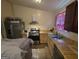 Galley style kitchen with stainless steel appliances and natural wood cabinets at 2071 Scarbrough, Stone Mountain, GA 30088