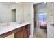 Bathroom with white sink, marble countertops and a view into the bedroom at 2817 Village Park E Dr, Ellenwood, GA 30294